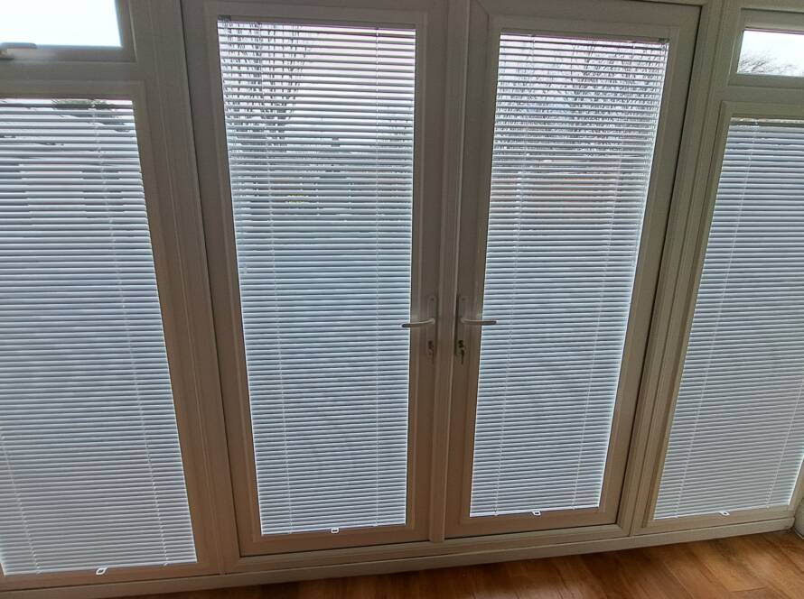 perfect fit venetian blinds elegantly cover patio doors, providing privacy and light control while enhancing the aesthetic appeal of your living space. Discover the perfect blend of functionality and style with our top-quality blinds selection.
